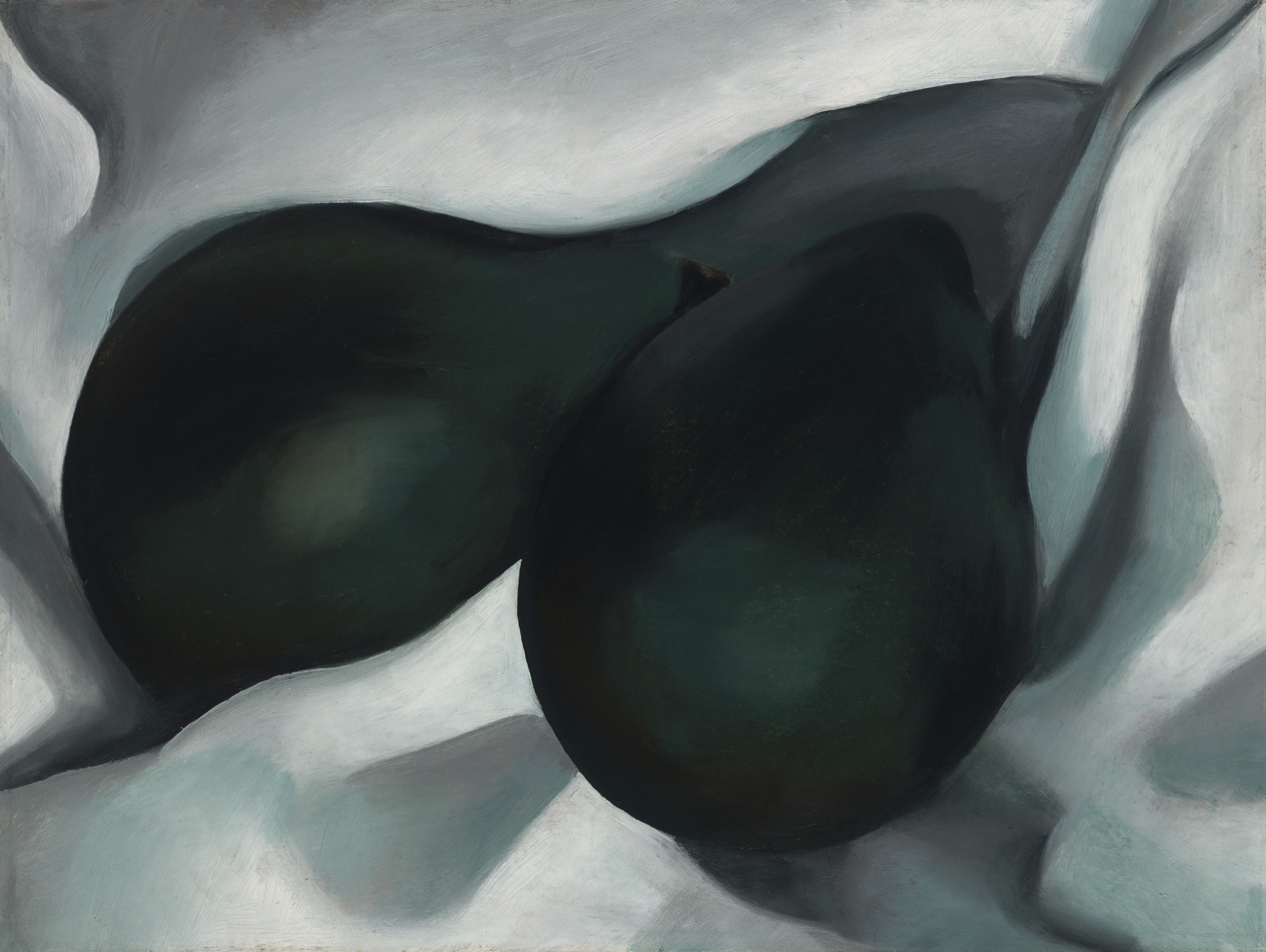 This beautiful composition consists of two dark green pear-esque shapes placed onto a seemingly silky cloth.