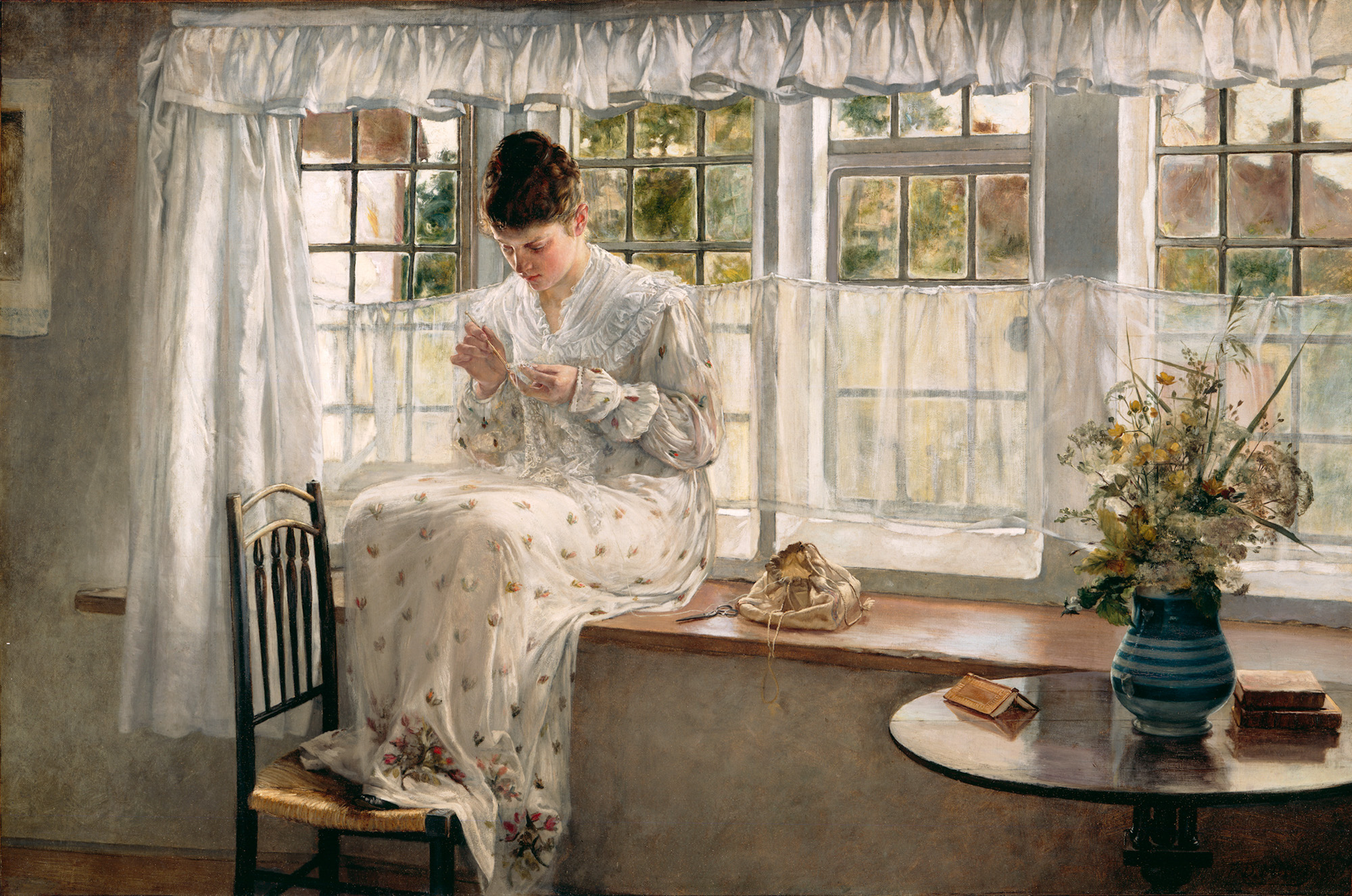 This image depicts a realist woman sitting in a window sewing. To her right is a table that holds a bouquet of yellow flowers. She is sitting in front of three windows, working while the sun pools in.