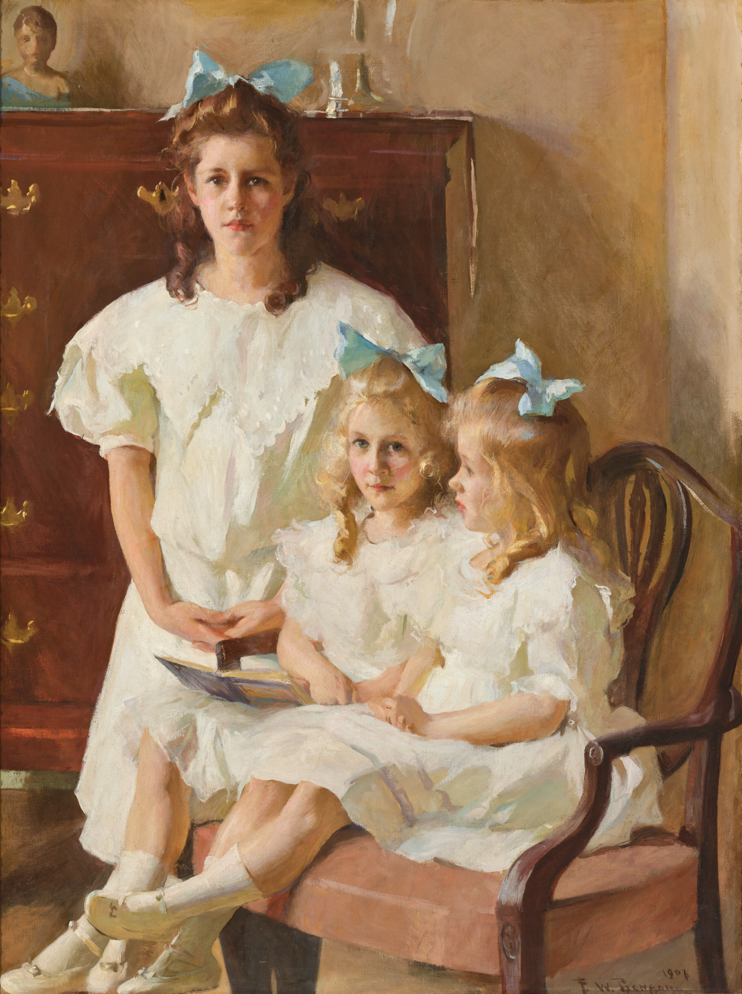 This image depicts three girls sitting. Two of them are blonde twins one of them is older is sitting above them. They are all in white dresses with bows.