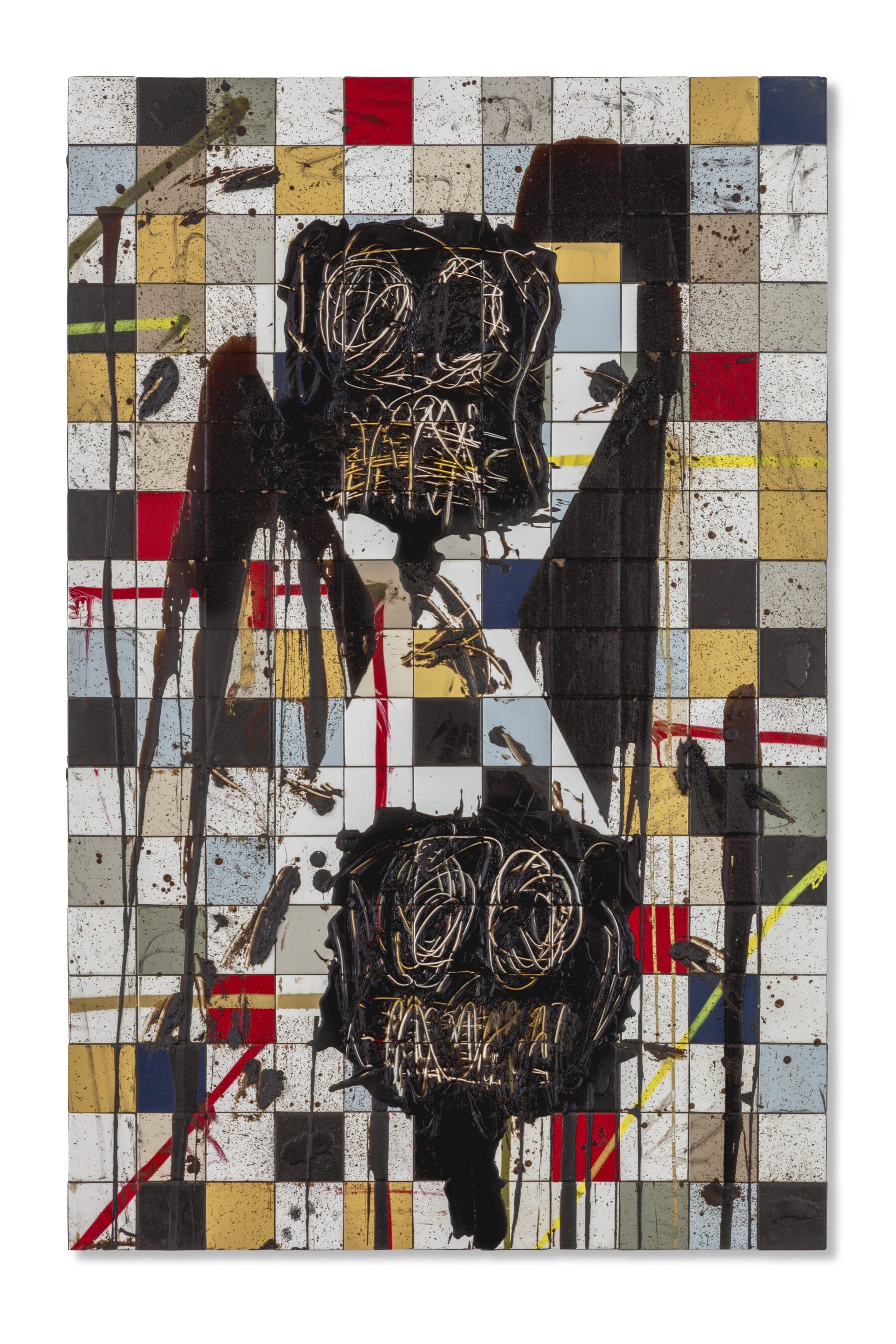 This bright image depicts to anxious faces carved out of black soap. The two heads are stacked and are on colorful tiles.
